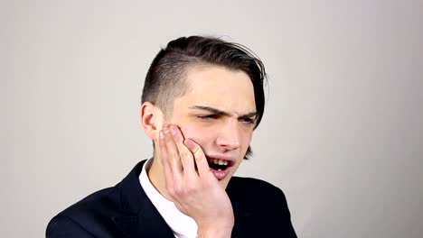 Young-businessman-with-a-toothache,-Tooth-Pain