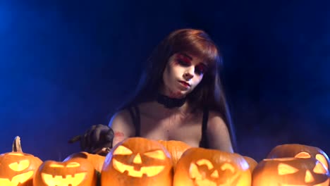 Woman-with-Halloween-pumpkins