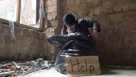 Homeless-man-find-a-cigarette-in-garbage-bag