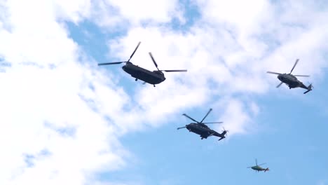 Five-helicopters-flying-on-the-sky-in-Palatine-hill-Rome-Italy