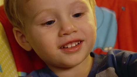 Video-Of-A-Young-Toddler-Boy-Making-A-Christmas-Wooden-Toy-Soldier-Craft-With-His-Mom-At-Their-Living-Room-Table