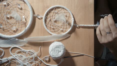 Female-Hands-Creating-Dream-Catcher-Closeup,-vertical-angle