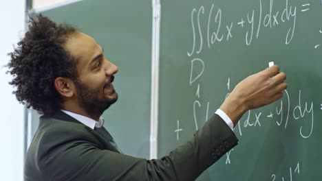 Teacher-of-Calculus-Explaining-Equations-at-Lecture