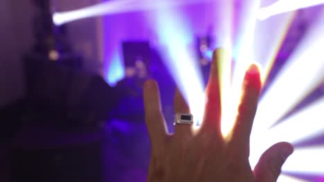 hand-raising-up-to-disco-light