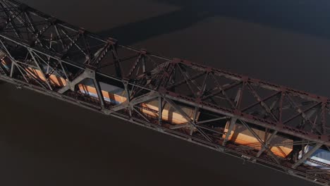 Aerial-View-Looking-Straight-Down-at-Cargo-Train-on-Bridge