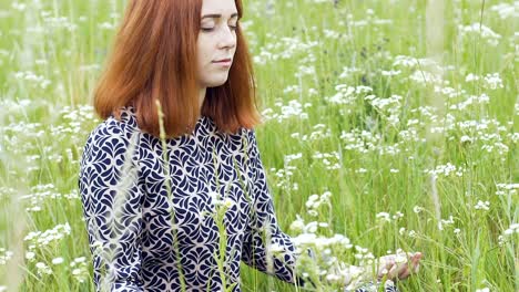 Meditation-outdoors,-beautiful-woman-sits-in-lotus-pose-closed-eyes-female-field