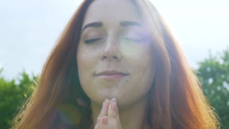 Praying-in-rain-red-haired-woman-with-freckles-feels-God-existence-peace-of-mind