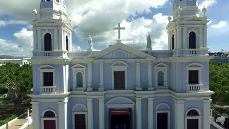 Tilt-up-shot-of-church-in-the-town-center-in-Ponce,-PR-and-aerial-view-of--city