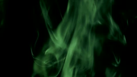 Green-Steam-Rises-from-up.-Blue-smoke-over-a-black-background.-Smoke-slowly-floating-through-space-against-black-background.-4K-UHD