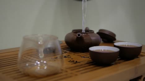 Pour-hot-water-into-the-clay-teapot.Chinese-tea-ceremony.