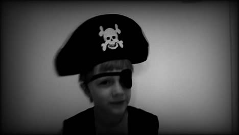 Halloween-pirate-kid-scaring,-close-up-old-video