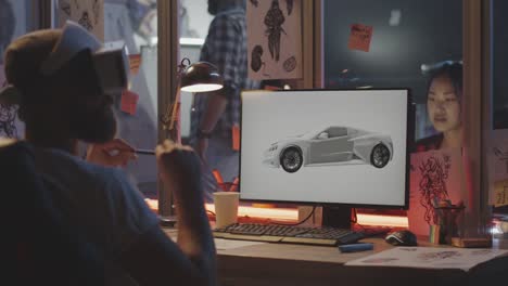 Man-modeling-car-on-computer