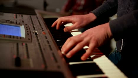 Young-man-playing-electronic-keyboard