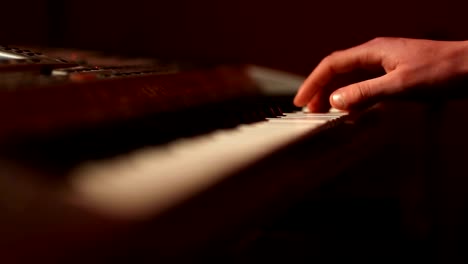 Musician-hands-on-piano-keyboard