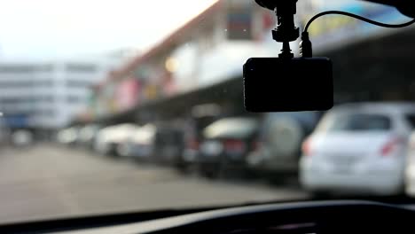 video-camera-recorder-in-car-driving-on-traffic-road,-slow-motion-shot