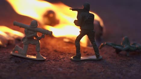 toy-soldier-in-the-fire.-The-model-of-the-battle-scene.-The-concept-of-the-cruelty-of-war