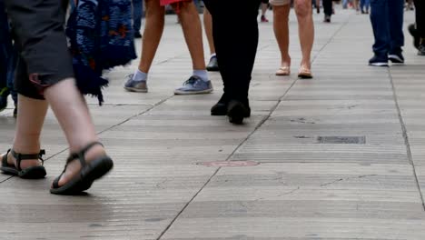 Foot-crowd-of-people-walking-on-megacity