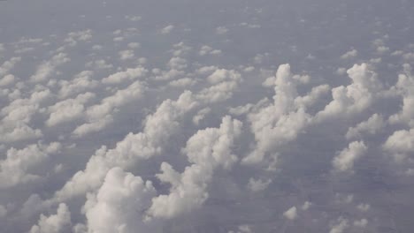 View-on-small-clouds-from-airplane-over-rural-areas-of-Thailand