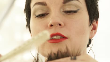 Woman-hairstylist-cutting-hair-with-scissors-during-master-class-in-hairdressing-school.-Close-up-haircutter-cutting-hair-with-professional-scissors-in-beauty-salon