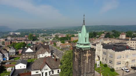 Slow-Reverse-Aerial-Establishing-Shot-of-Church-in-Small-Town-USA