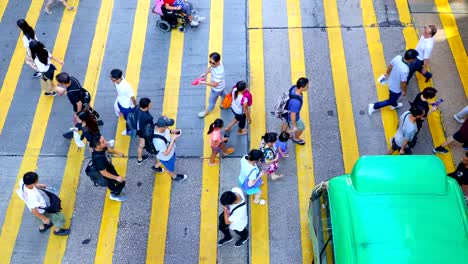 Busy-pedestrian-and-car-crossing-at-Mong-Kok---time-lapse