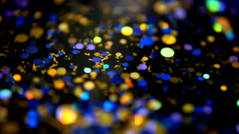 Defocused-shimmering-multicolored-glitter-confetti,-black-background.-Party,-magic,-imagination.-Rainbow-colors,-sparkle-circles.-Holiday-abstract-festive-texture-of-shiny-blurred-bokeh-light-spots.