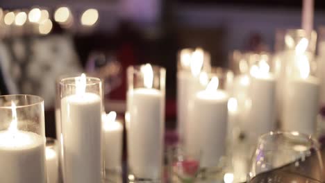 Decorative-candles-burning-on-a-banquet-table