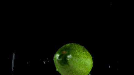 avocado-on-a-black-background.-Slow-motion.