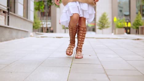 unrecognizable-girl-walking-on-the-street