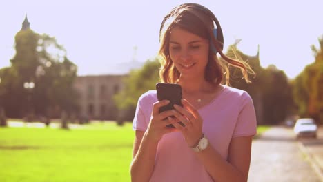 happy-female-texting-message-at-the-open-air