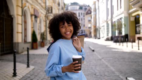 Portrait-of-dark-skinned-girl-with-shopping-bags