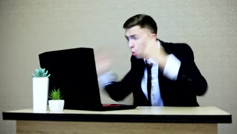 Angry-businessman-screaming-on-laptop-and-gesticulating