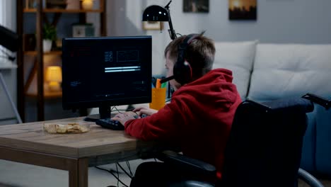 Disabled-boy-hacking-on-his-computer