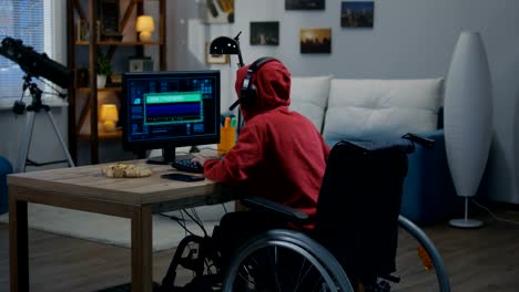 Disabled-boy-hacking-on-his-computer