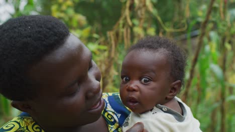 Mother-holding-and-playing-with-her-baby