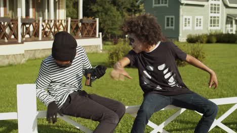 Two-Boys-in-Halloween-Costumes-Having-Fun