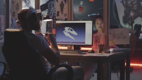 Man-modeling-dinosaur-skull-on-computer