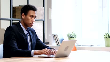 Black-Businessman-Waiting-at-Work,-Watching-Time