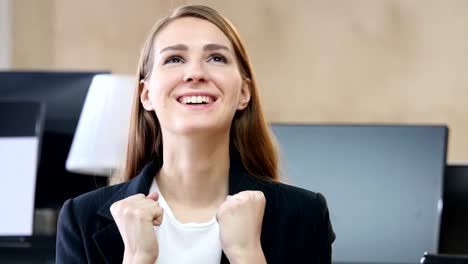 Happy-Excited-Woman-in-Office