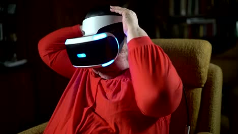 Elderly-woman-wearing-VR-headset-in-front-of-TV-screen