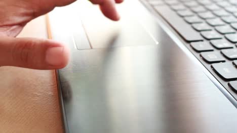 businessman-typing-on-a-laptop-keyboard-in-blurred-focus