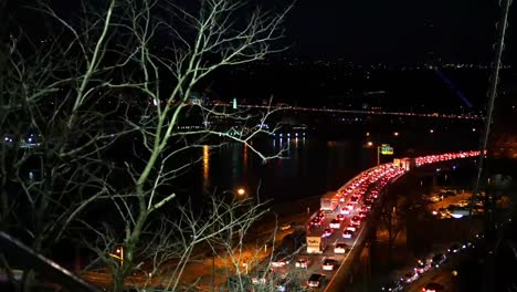 A-Traffic-jam-at-night-on-an-overpass-bridge-near-downtown