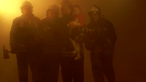 Firefighters-with-rescued-child