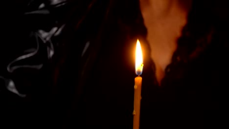 Witch-extinguish-the-candle-with-hand