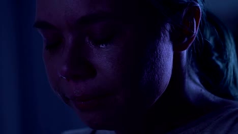 Close-up-portrait-of-crying-young-woman-with-nose-bleeding,-domestic-violence