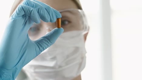 Female-Scientist-Examining-New-Pill