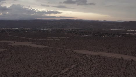 The-sunset-in-the-desert-flying-over-trees-and-shrubs