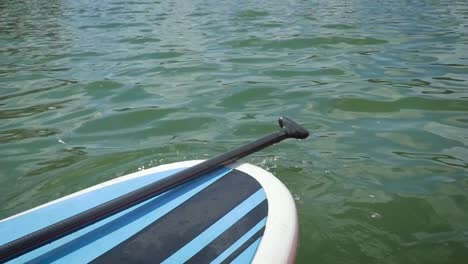 Stand-Up-Paddle-Board-on-a-Lake-in-Slow-Motion