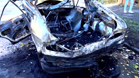 The-blown-up-car-as-a-result-of-terrorist-attack.	Car-after-terrorist-attack.