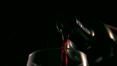 Extreme-close-up-of-red-wine-poured-into-glass